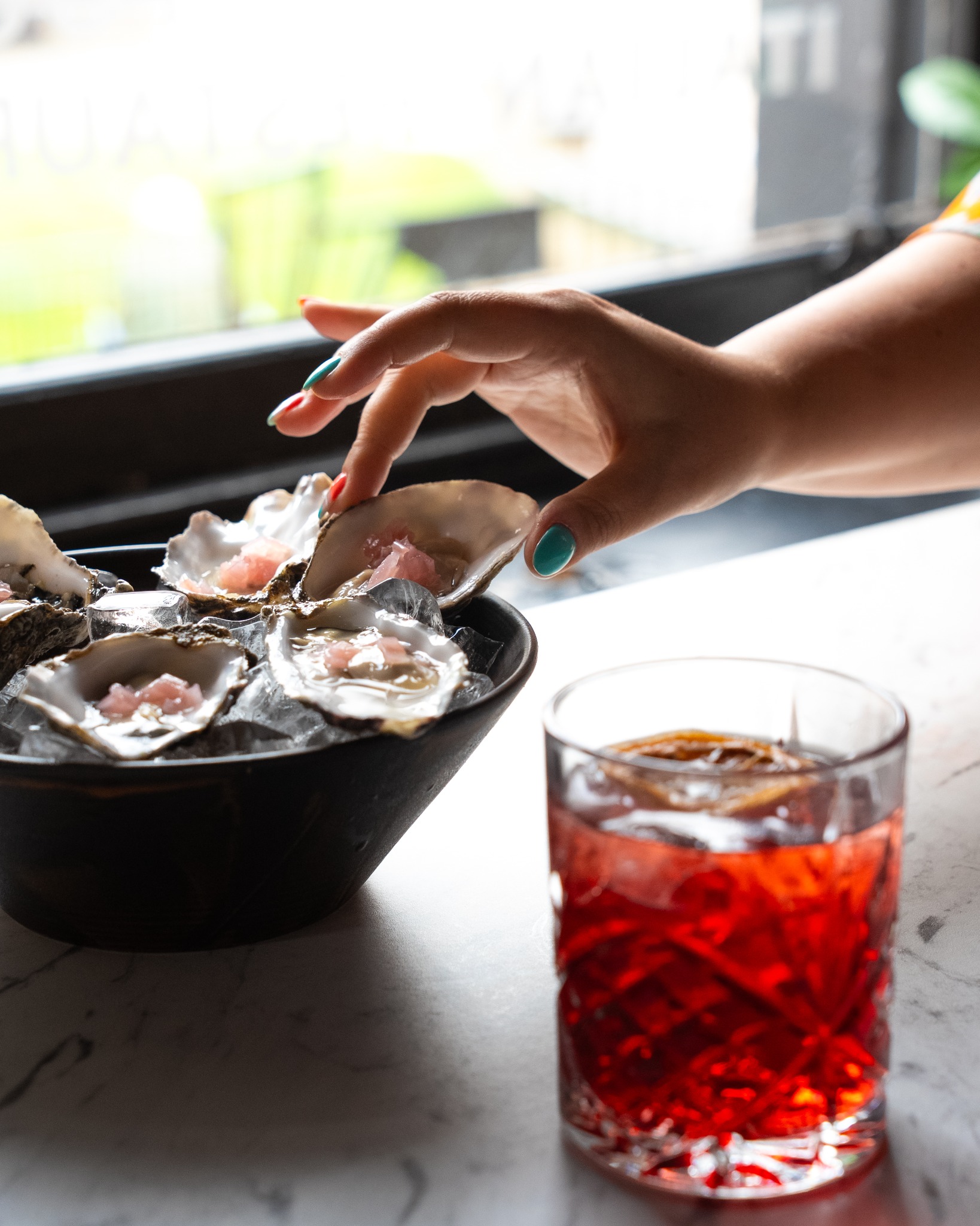 Oysters and cocktail at Don Padrino